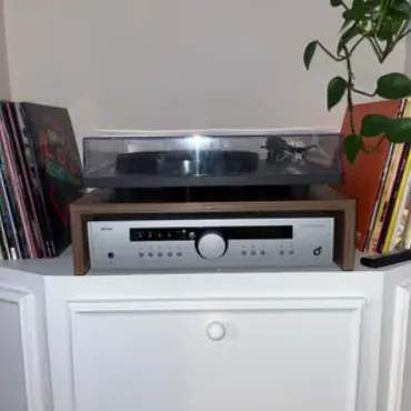 Dark stained turntable riser.